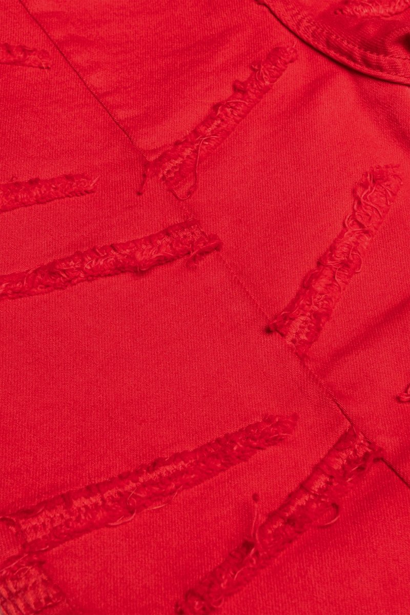 “SABER” STACKED FLARE JEAN RED WASHED